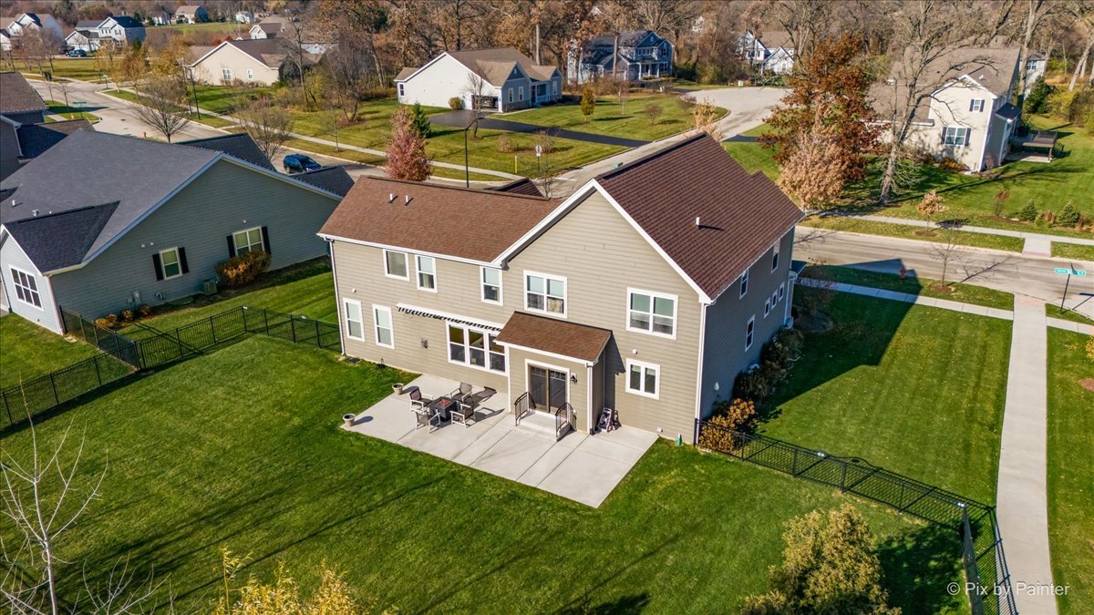 4375 Rudyard Kipling Road Elgin, IL 60124 - Photo 31 of 33 an aerial view of a house with a yard