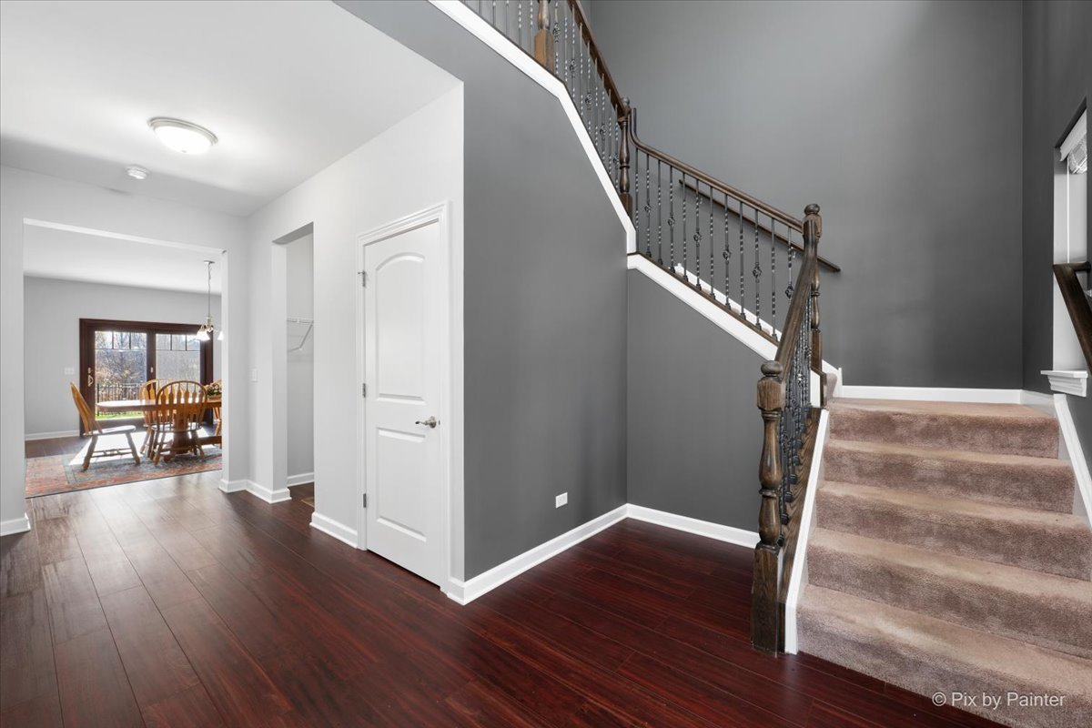 4375 Rudyard Kipling Road Elgin, IL 60124 - Photo 4 of 33 a view of entryway with wooden floor