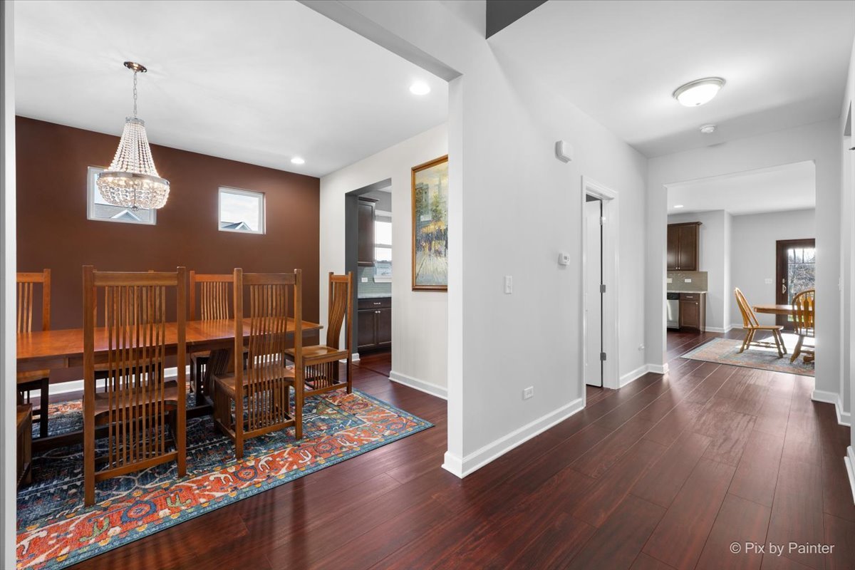 4375 Rudyard Kipling Road Elgin, IL 60124 - Photo 5 of 33 a view of a livingroom with furniture wooden floor and chandelier