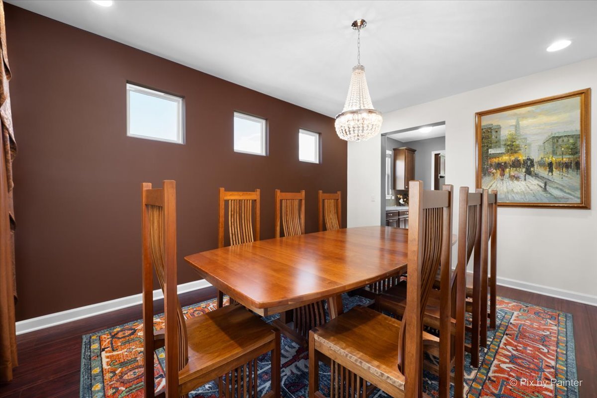 4375 Rudyard Kipling Road Elgin, IL 60124 - Photo 6 of 33 a view of a dining room with furniture and wooden floor