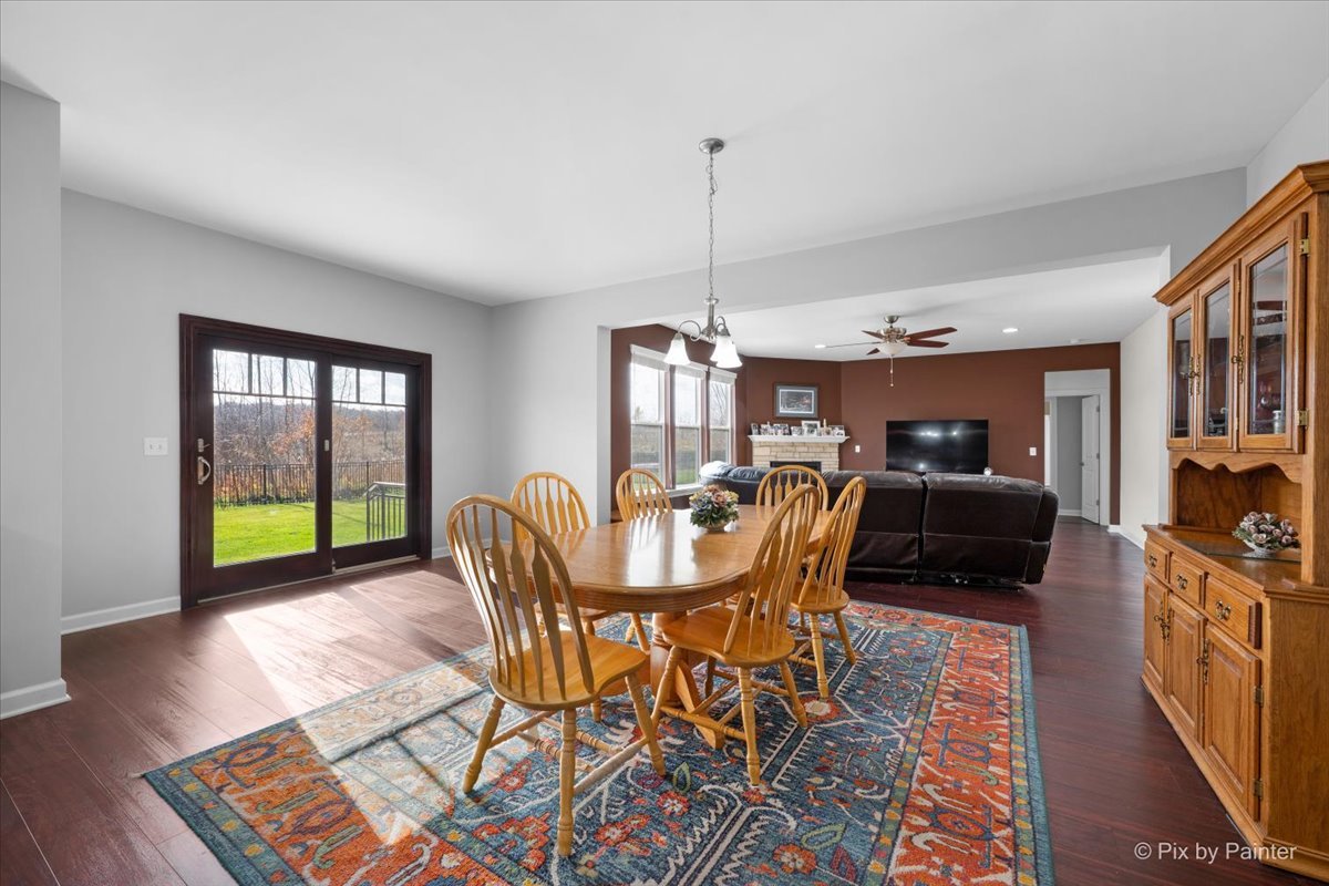 4375 Rudyard Kipling Road Elgin, IL 60124 - Photo 10 of 33 a view of a dining room with furniture window and wooden floor
