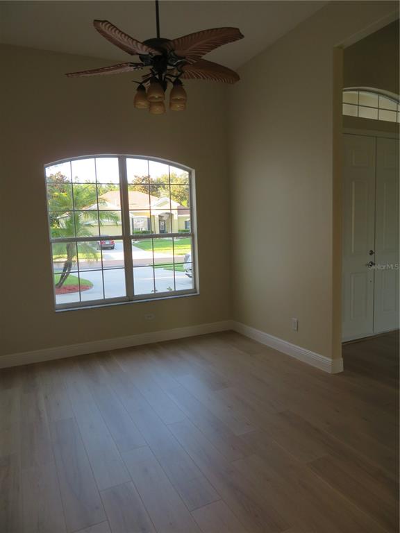 2735 Kingston Ridge Drive Clermont, FL 34711 - Photo 12 of 51 an empty room with a window