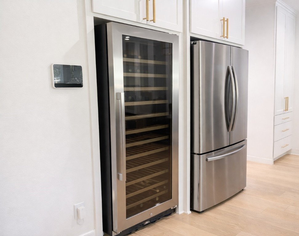 5515 Chase Harbor Houston, TX 77041 - Photo 15 of 48 Integrated wine refrigeration and thoughtful storage elevate the entertaining experience, making this kitchen as functional as it is impressive.