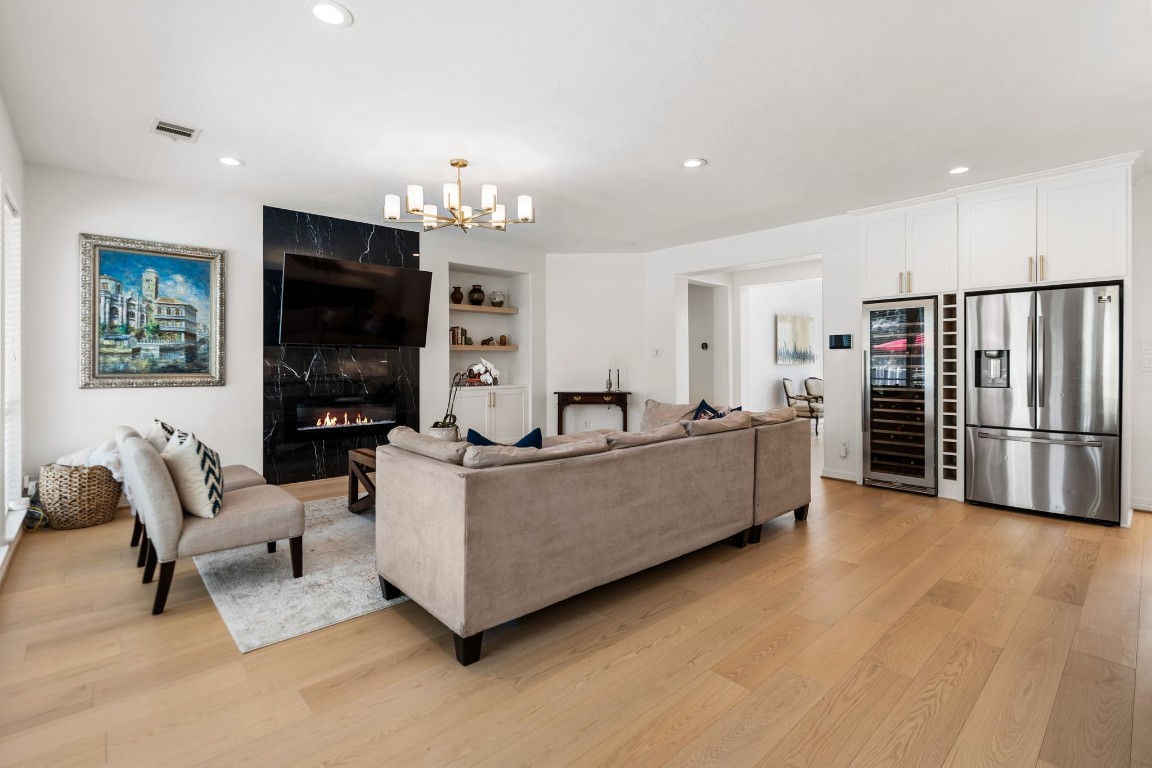 5515 Chase Harbor Houston, TX 77041 - Photo 17 of 48 Open sightlines and expansive gathering space make this main living area ideal for both large-scale entertaining and comfortable daily living.