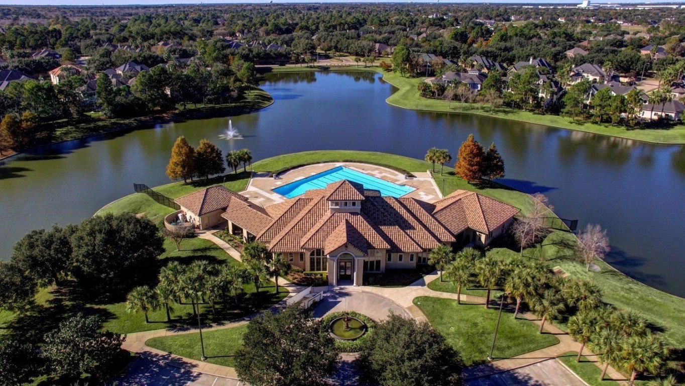 5515 Chase Harbor Houston, TX 77041 - Photo 42 of 48 The elegant lakeside clubhouse serves as the heart of the community, offering gathering spaces, events & stunning water views.