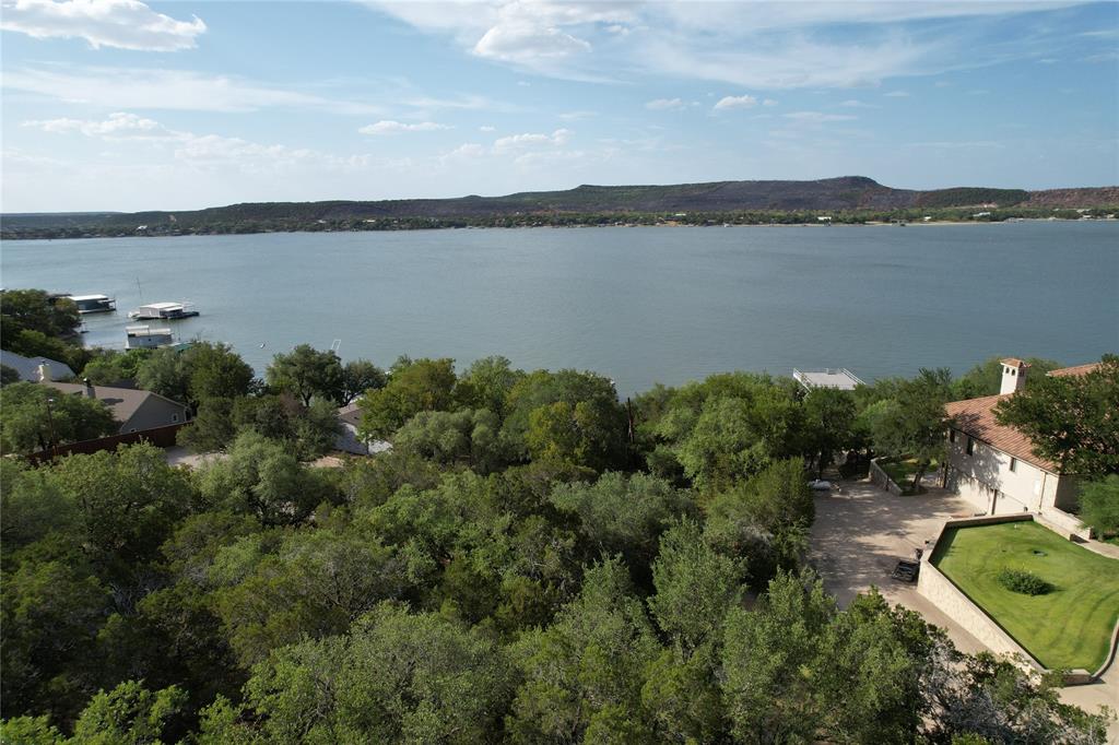 2217 Trl Rdg Road Graford, TX 76449 - Photo 5 of 9 a view of a lake with couches in the back