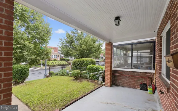 a backyard of a house with yard and outdoor seating