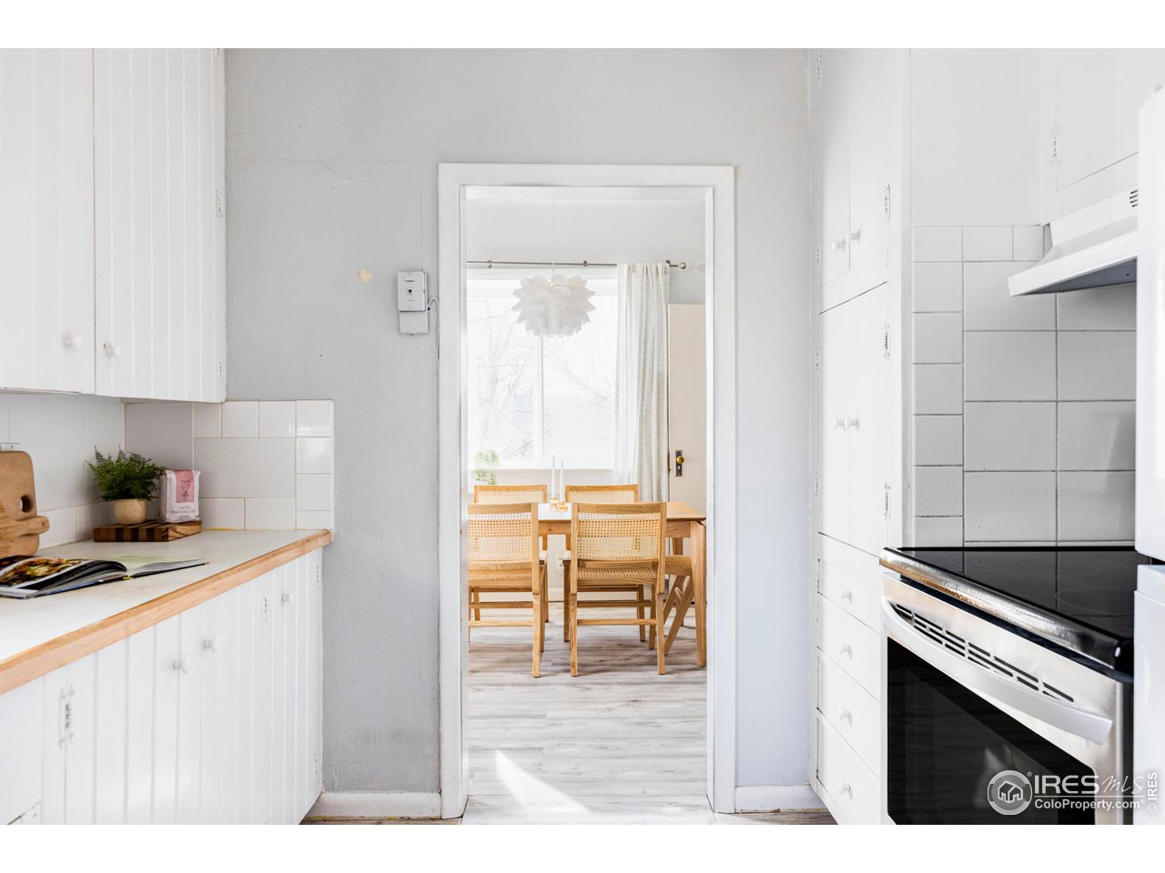 635 Alpine Avenue Boulder, CO 80304 - Photo 15 of 22 a kitchen with granite countertop a stove a sink and a refrigerator