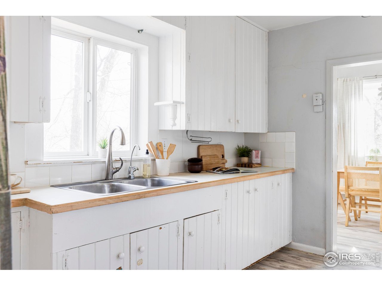 635 Alpine Avenue Boulder, CO 80304 - Photo 18 of 22 a kitchen with kitchen island granite countertop a sink cabinets and window