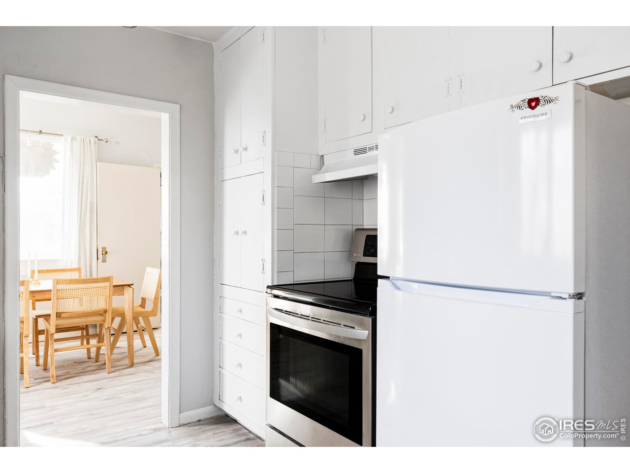 635 Alpine Avenue Boulder, CO 80304 - Photo 19 of 22 a kitchen with granite countertop a refrigerator a stove a washer and dryer