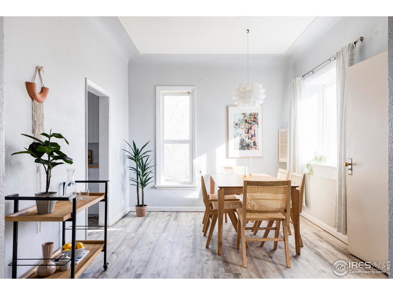 635 Alpine Avenue Boulder, CO 80304 - Photo 10 of 22 a view of a dining room with furniture and wooden floor