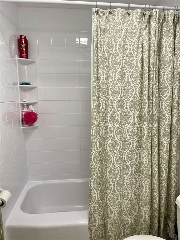 176 Maple Avenue, Unit 133 Rutland, MA 01543 - Photo 12 of 14 a bathroom with a bathtub and shower