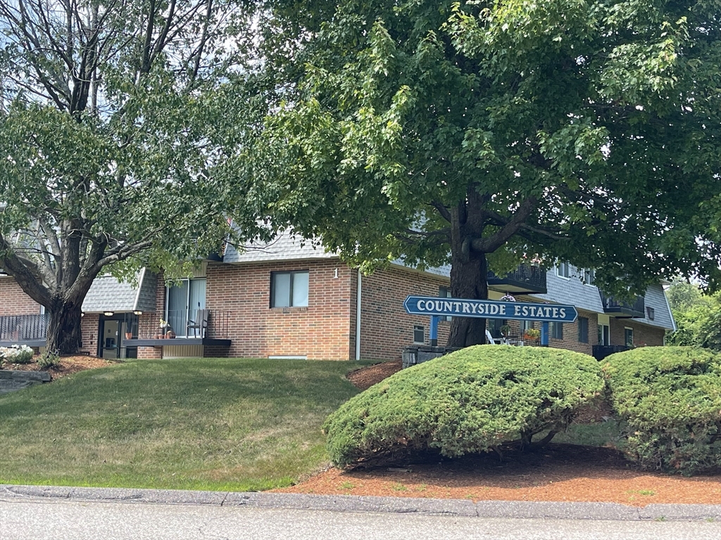 176 Maple Avenue, Unit 133 Rutland, MA 01543 - Photo 14 of 14 a front view of a house with garden