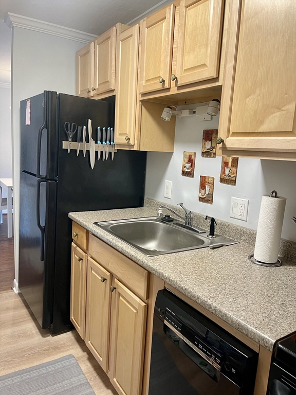 176 Maple Avenue, Unit 133 Rutland, MA 01543 - Photo 4 of 14 a kitchen with granite countertop a sink stove and refrigerator