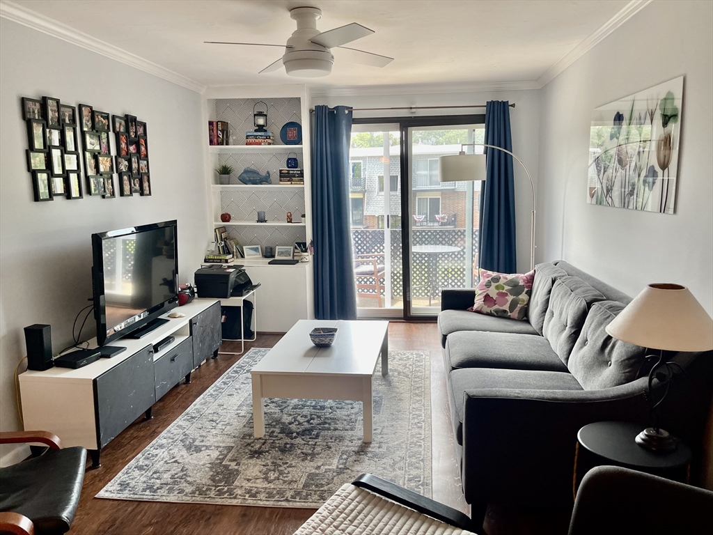 176 Maple Avenue, Unit 133 Rutland, MA 01543 - Photo 6 of 14 a living room with furniture a rug and a flat screen tv