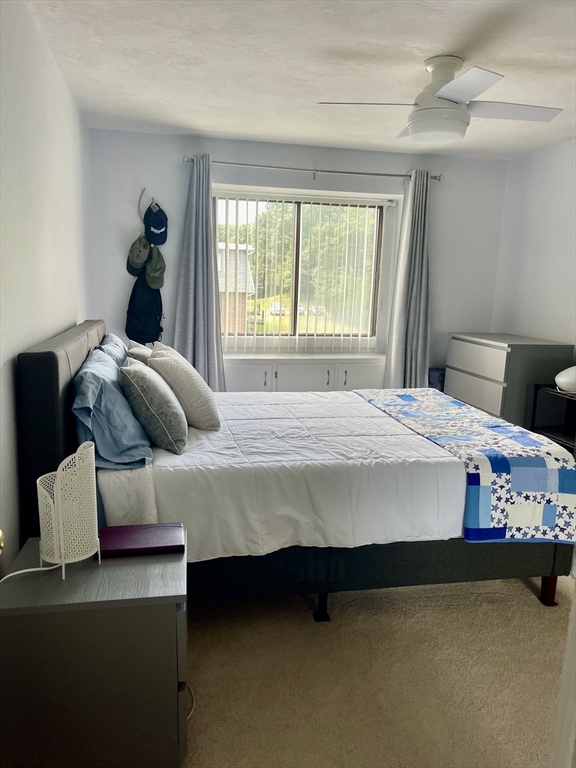 176 Maple Avenue, Unit 133 Rutland, MA 01543 - Photo 9 of 14 a bedroom with a bed and a window