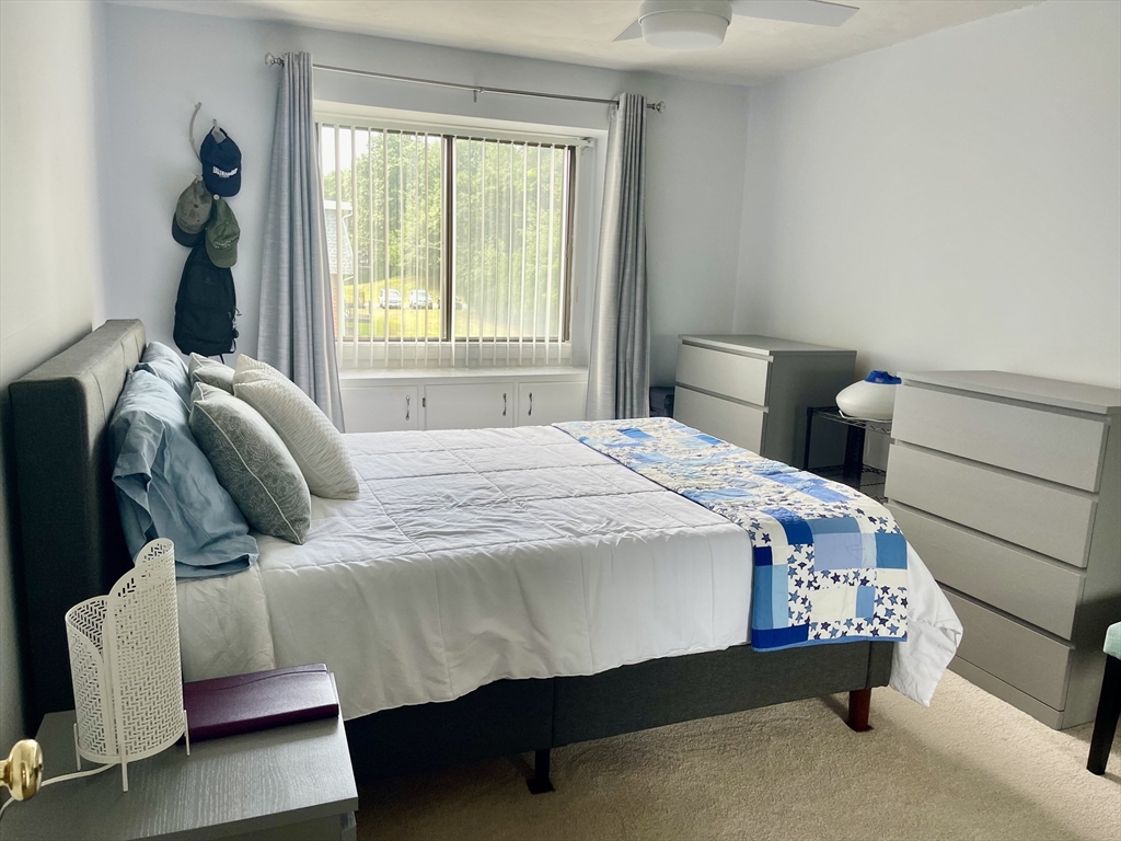 176 Maple Avenue, Unit 133 Rutland, MA 01543 - Photo 10 of 14 a bedroom with a bed and window