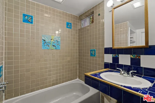 a bathroom with a sink and a bathtub