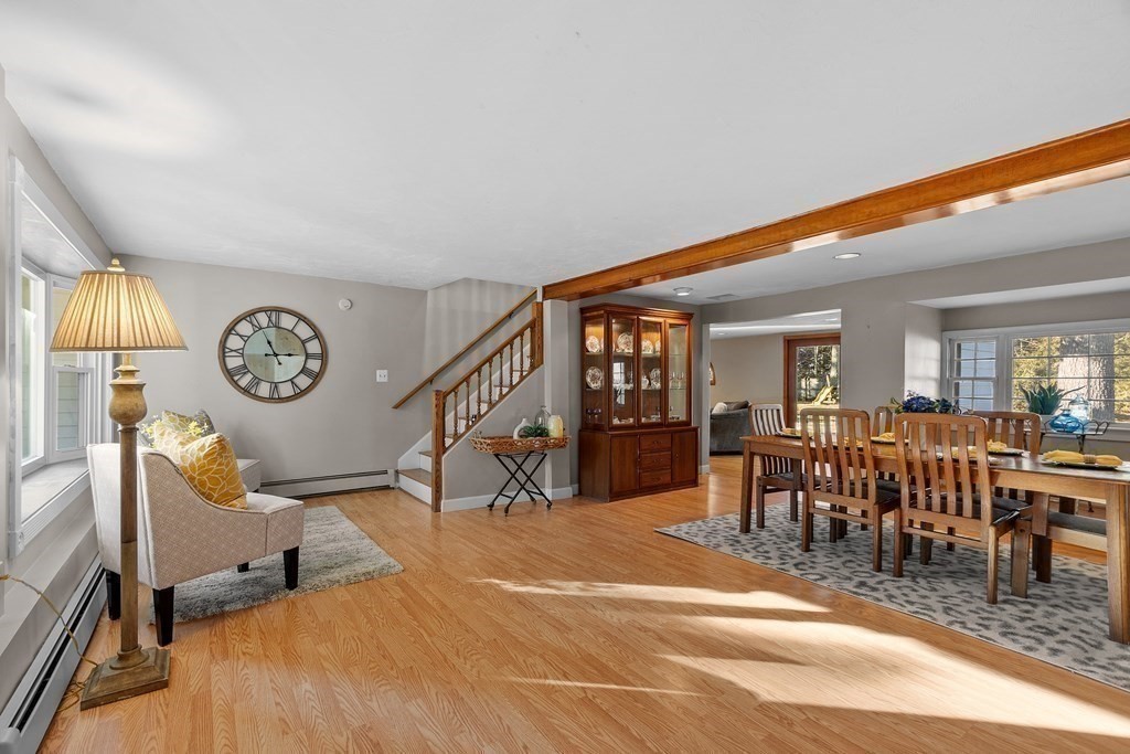 67 Pine Street Sudbury, MA 01776 - Photo 13 of 41 a very nice looking room with a large window and a clock