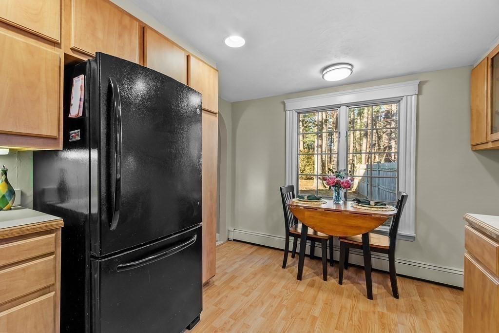 67 Pine Street Sudbury, MA 01776 - Photo 20 of 41 a kitchen with stainless steel appliances granite countertop a refrigerator and a table