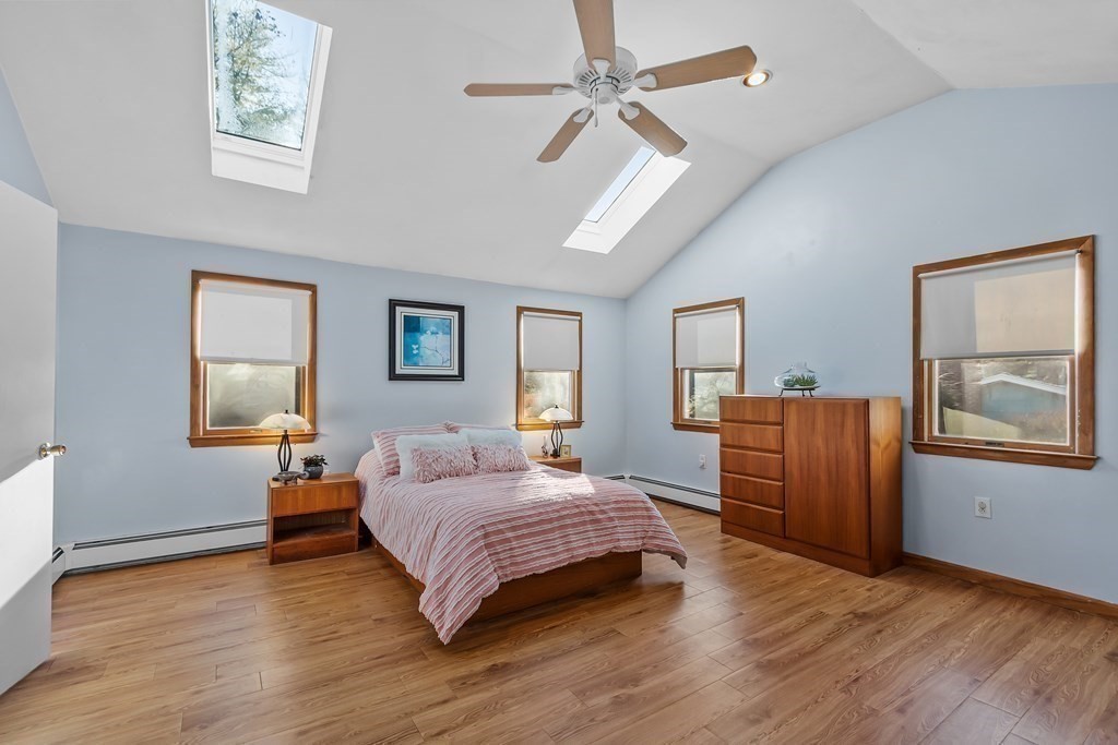 67 Pine Street Sudbury, MA 01776 - Photo 22 of 41 a bedroom with a large bed and a window