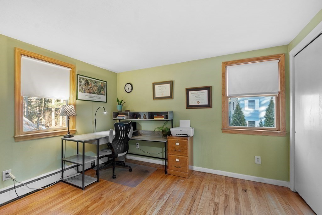 67 Pine Street Sudbury, MA 01776 - Photo 25 of 41 a view of a workspace with wooden floor and a window