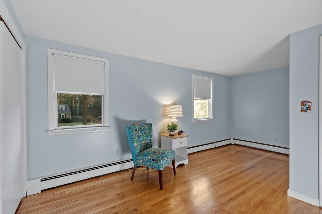 67 Pine Street Sudbury, MA 01776 - Photo 26 of 41 a living room with wooden floor and a window