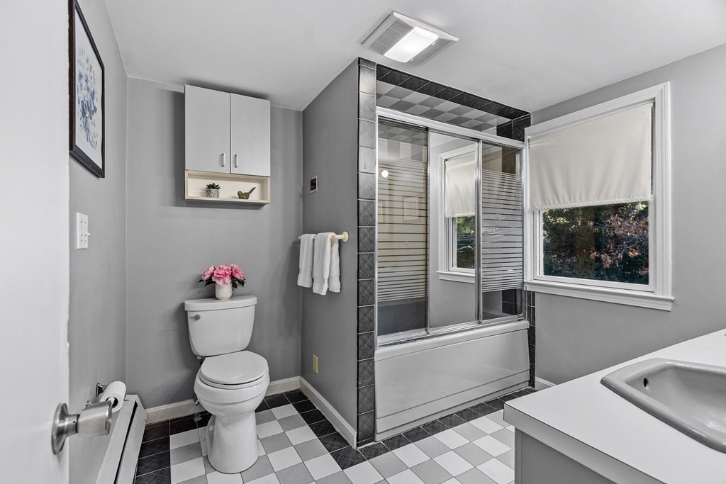 67 Pine Street Sudbury, MA 01776 - Photo 27 of 41 a bathroom with a toilet and a shower