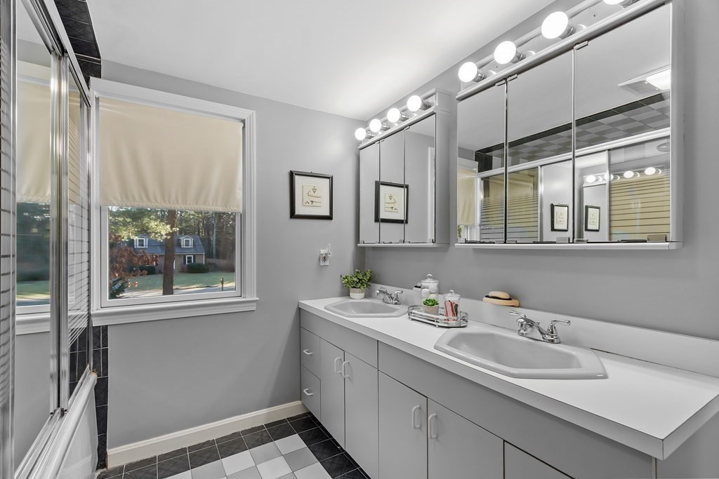 67 Pine Street Sudbury, MA 01776 - Photo 28 of 41 a bathroom with a sink and a mirror