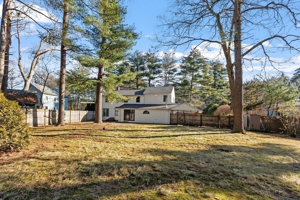 67 Pine Street Sudbury, MA 01776 - Photo 35 of 41 a view of a house with a yard covered with snow