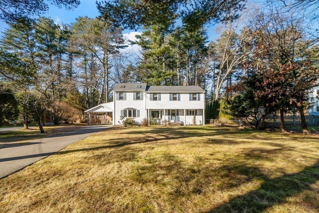67 Pine Street Sudbury, MA 01776 - Photo 36 of 41 a view of a house with a yard and large trees