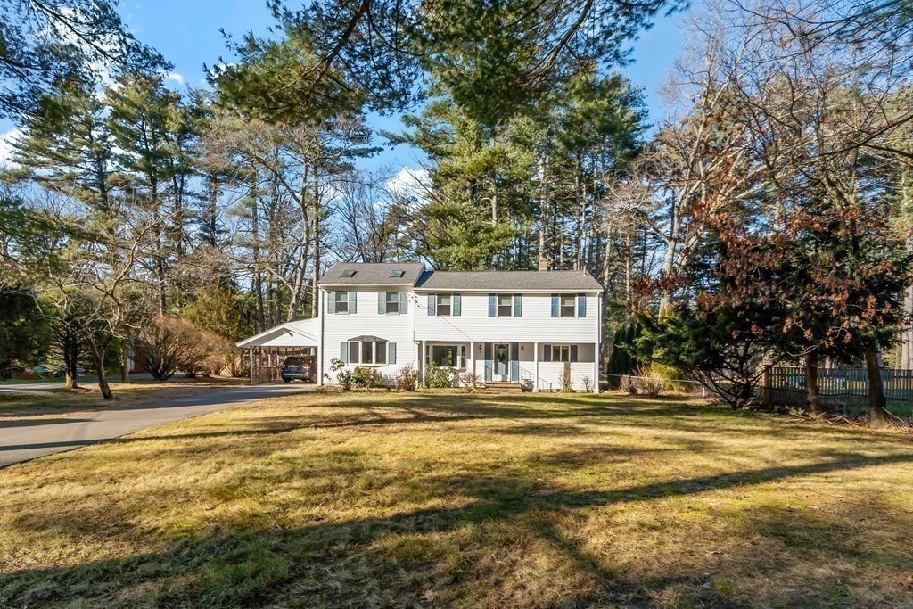 67 Pine Street Sudbury, MA 01776 - Photo 38 of 41 a front view of residential building with outdoor space and trees