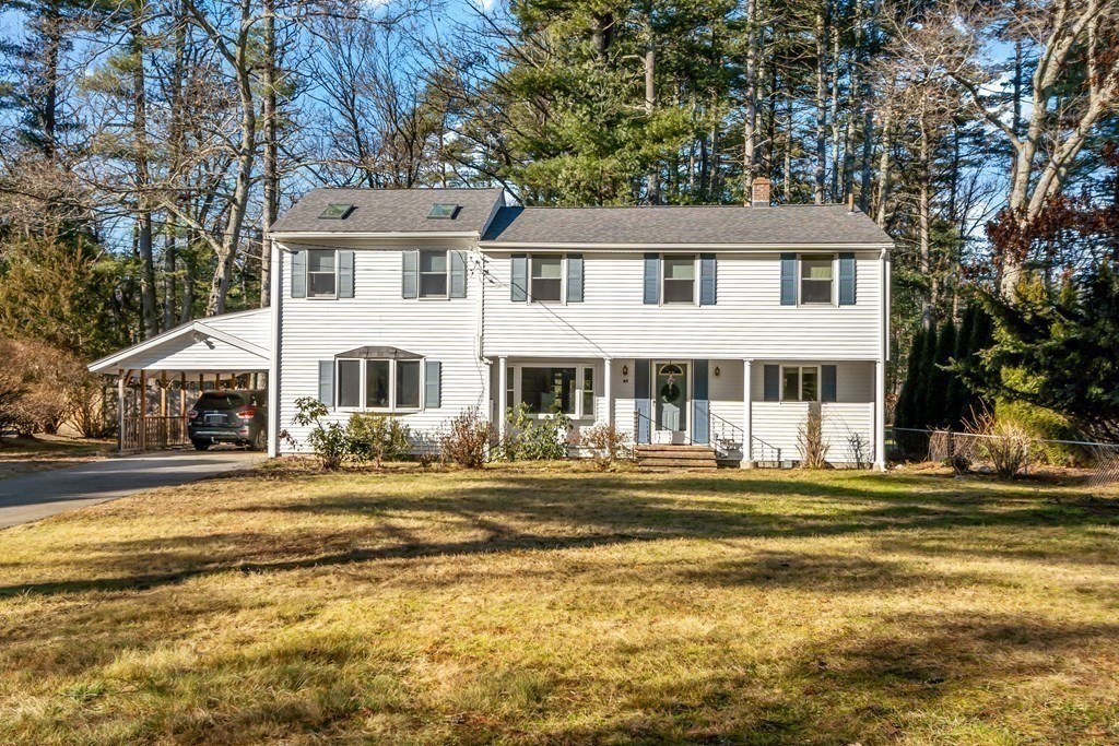 67 Pine Street Sudbury, MA 01776 - Photo 40 of 41 a front view of a house with a yard