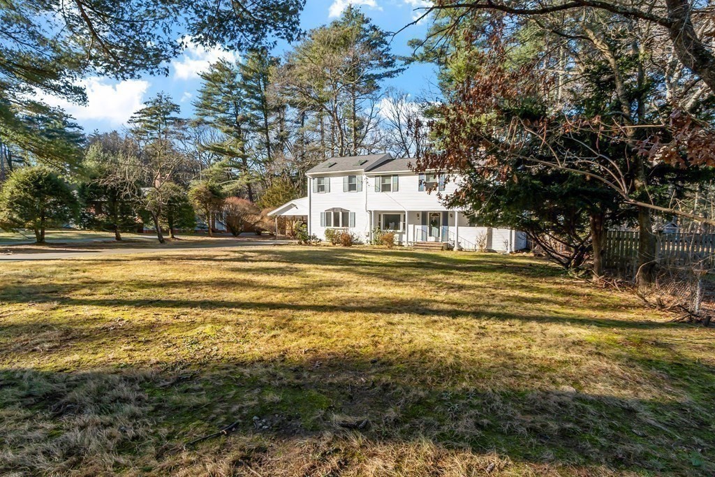 67 Pine Street Sudbury, MA 01776 - Photo 4 of 41 a view of a swimming pool with outdoor seating and trees