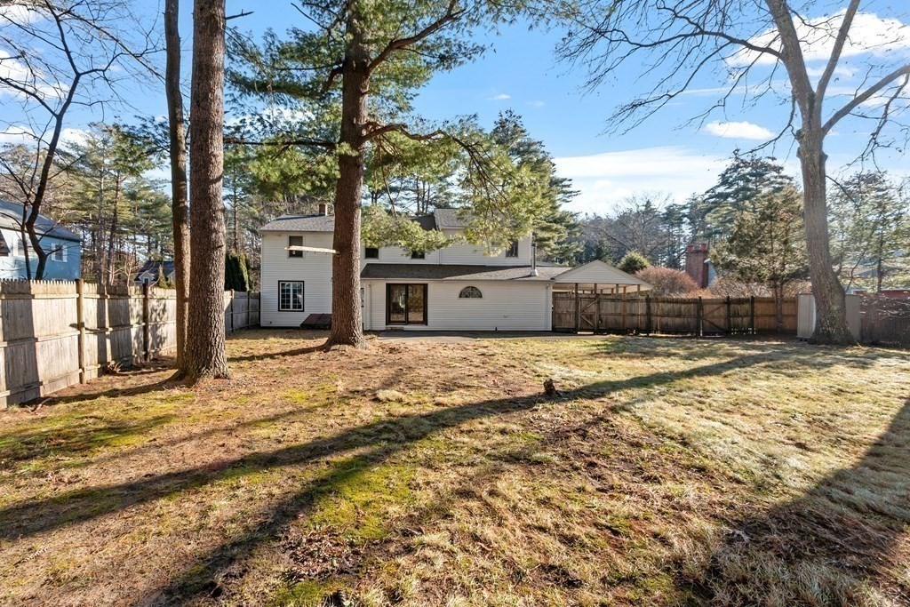 67 Pine Street Sudbury, MA 01776 - Photo 6 of 41 a view of a yard with a house and a tree