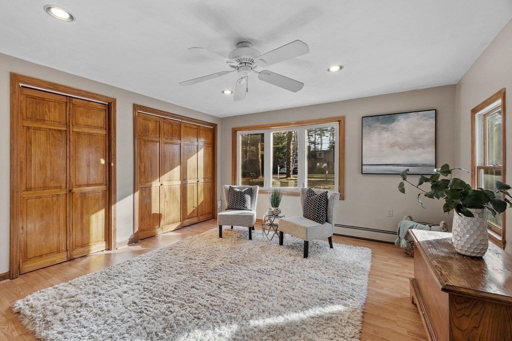 67 Pine Street Sudbury, MA 01776 - Photo 8 of 41 a living room with furniture and large windows