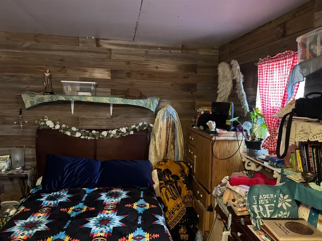 a store room with lots of different colored cloths