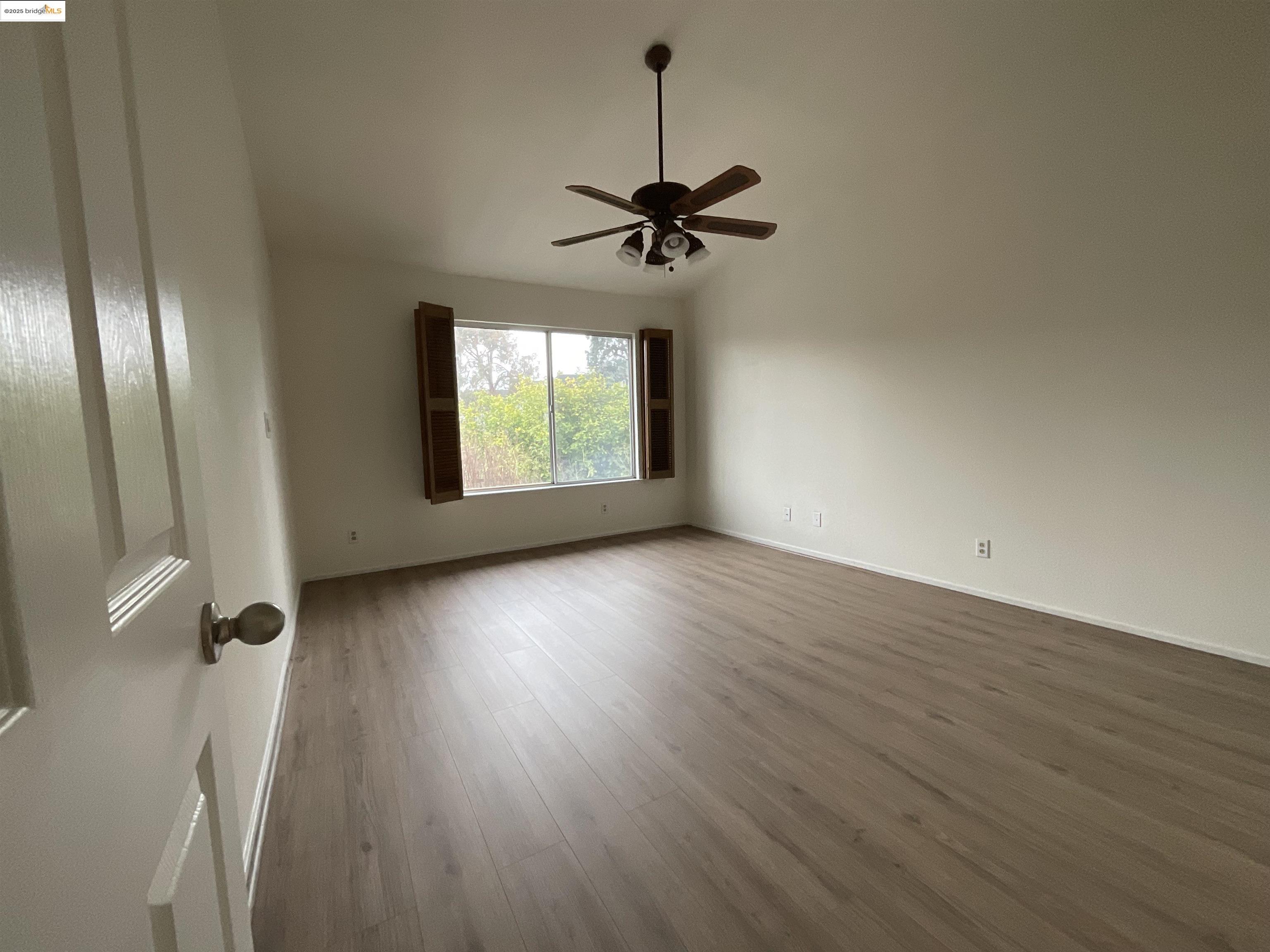 131 Pelican Loop Pittsburg, CA 94565 - Photo 12 of 16 wooden floor in an empty room with a window