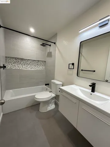 a bathroom with a toilet a sink and a bathtub