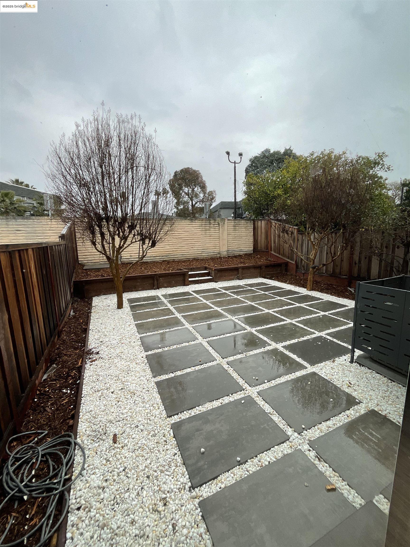 131 Pelican Loop Pittsburg, CA 94565 - Photo 15 of 16 a view of a backyard with pathway