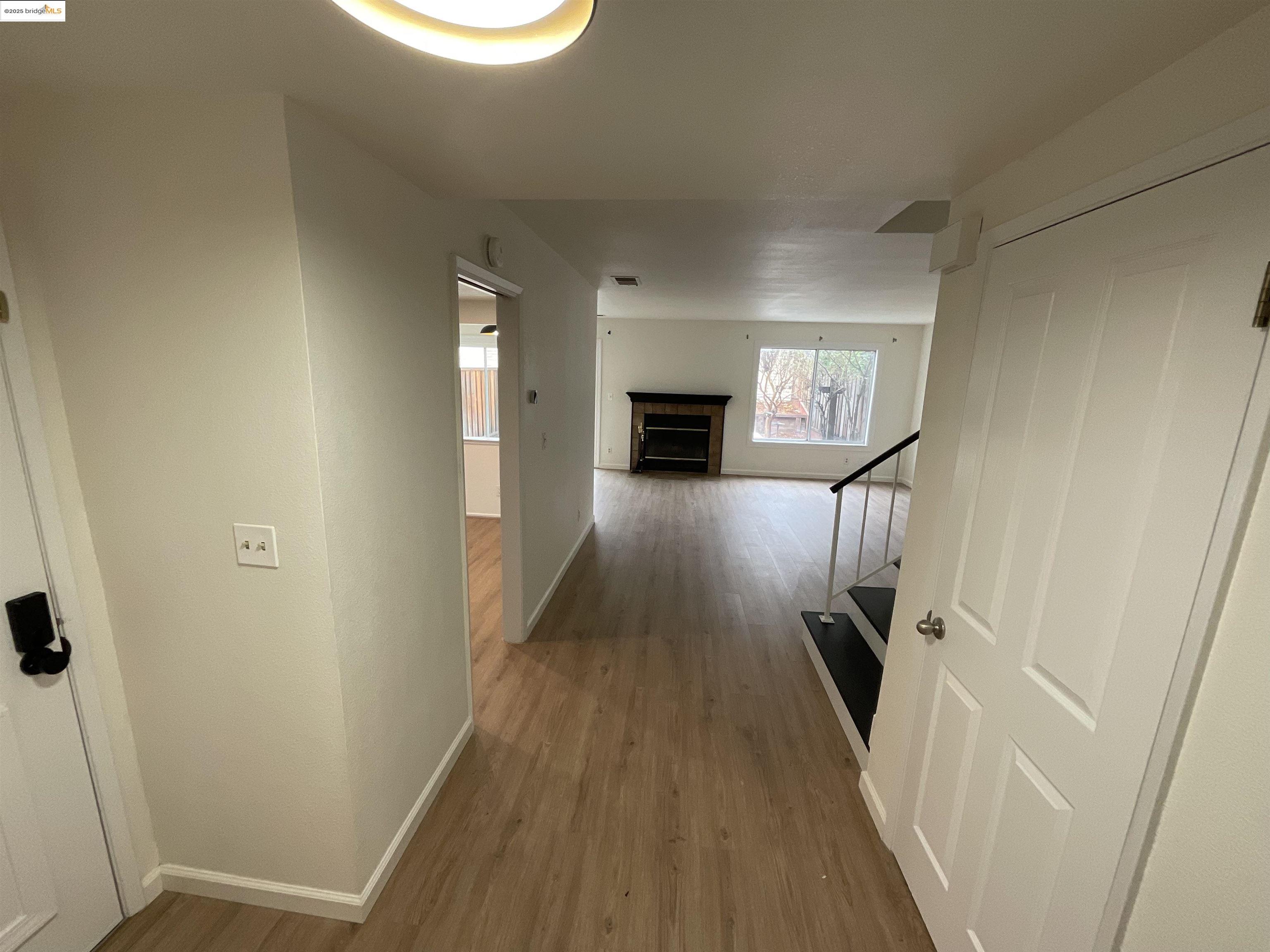 131 Pelican Loop Pittsburg, CA 94565 - Photo 2 of 16 a view of a livingroom with wooden floor