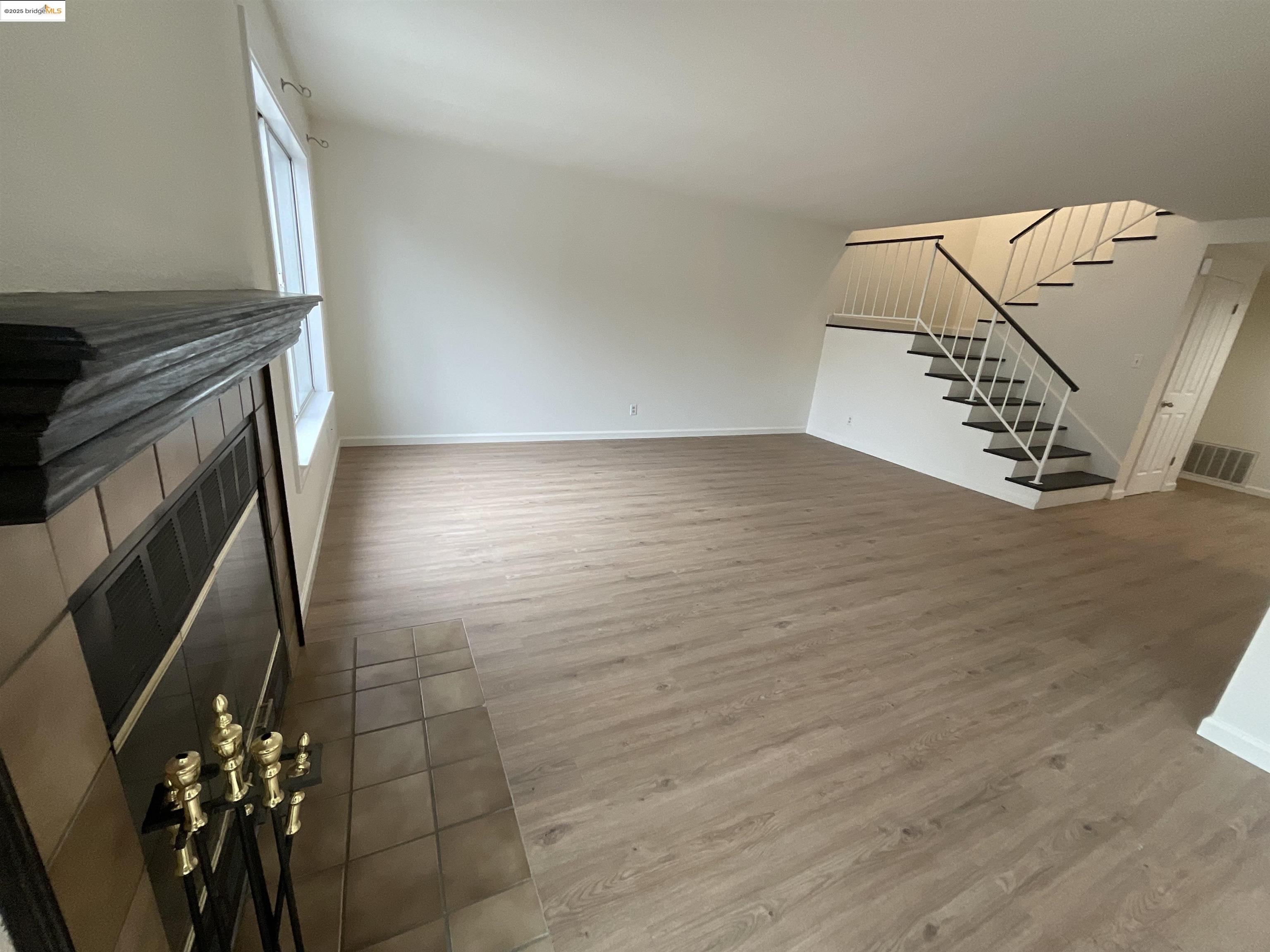 131 Pelican Loop Pittsburg, CA 94565 - Photo 4 of 16 wooden floor with staircase
