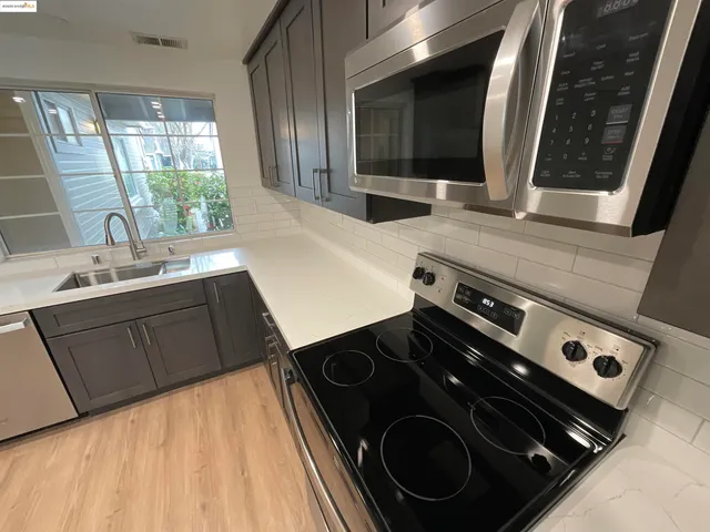 a kitchen with a stove and a sink