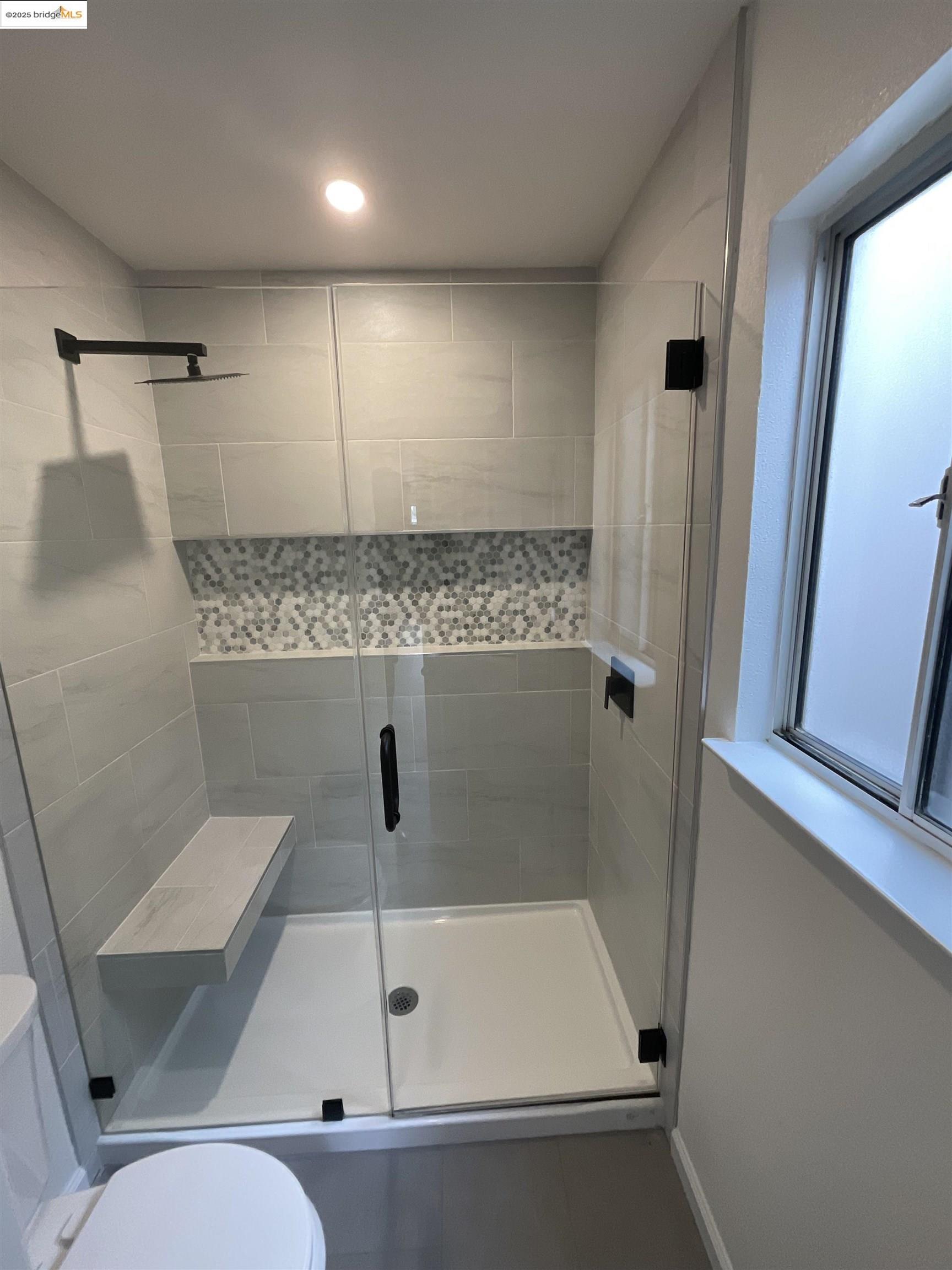 131 Pelican Loop Pittsburg, CA 94565 - Photo 10 of 16 a bathroom with a shower and toilet