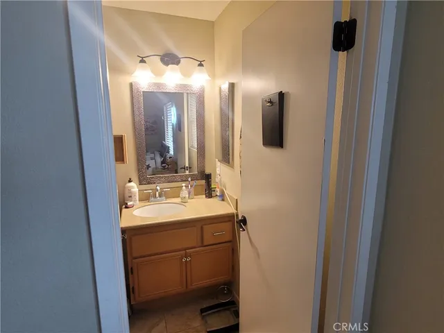 a bathroom with a double vanity sink and mirror
