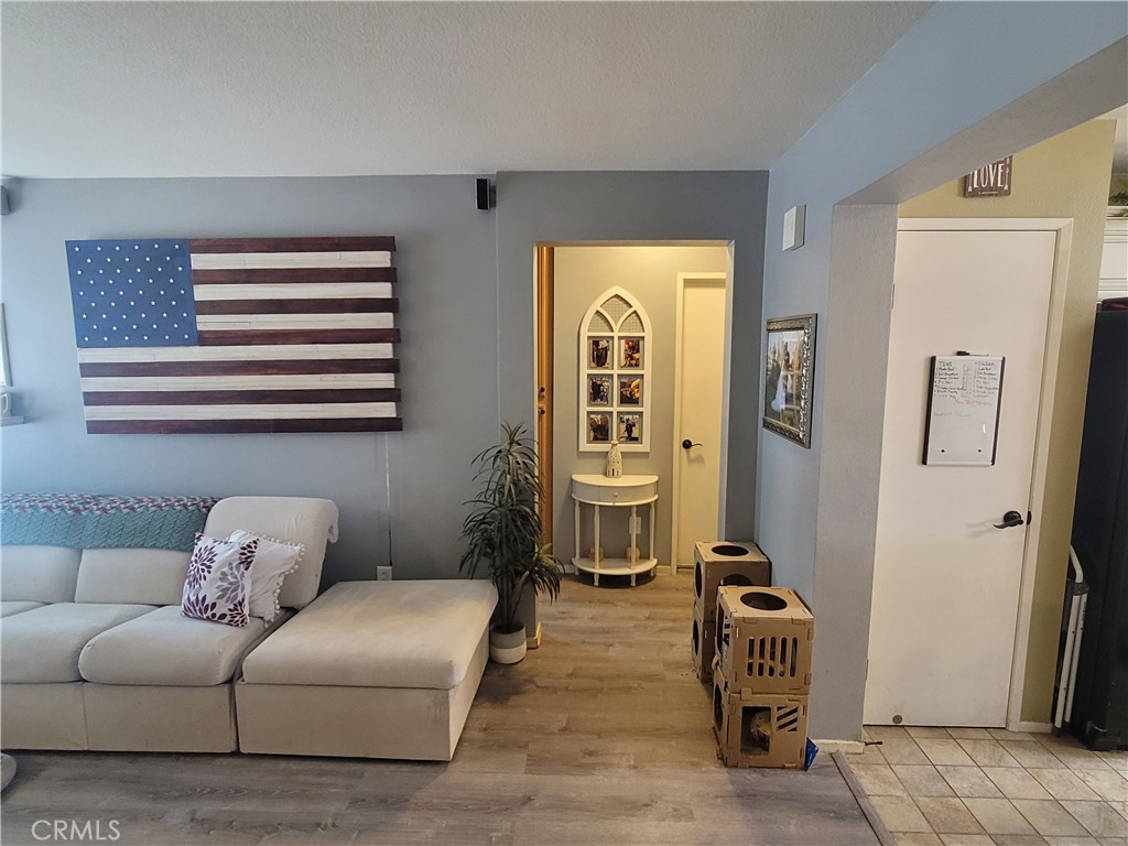 11930 Poppy Road Adelanto, CA 92301 - Photo 16 of 22 a living room with furniture and a window