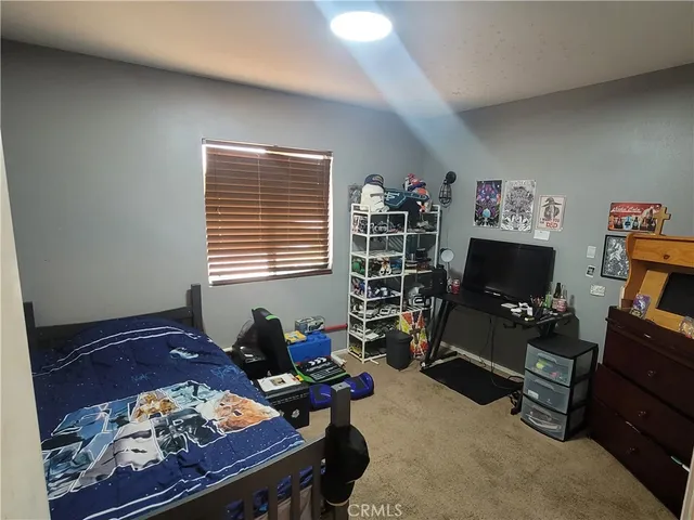 a livingroom with workspace and a window