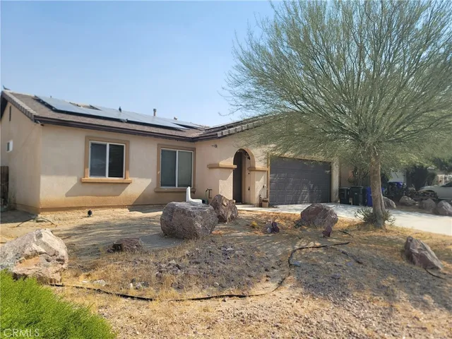 a house view with a outdoor space