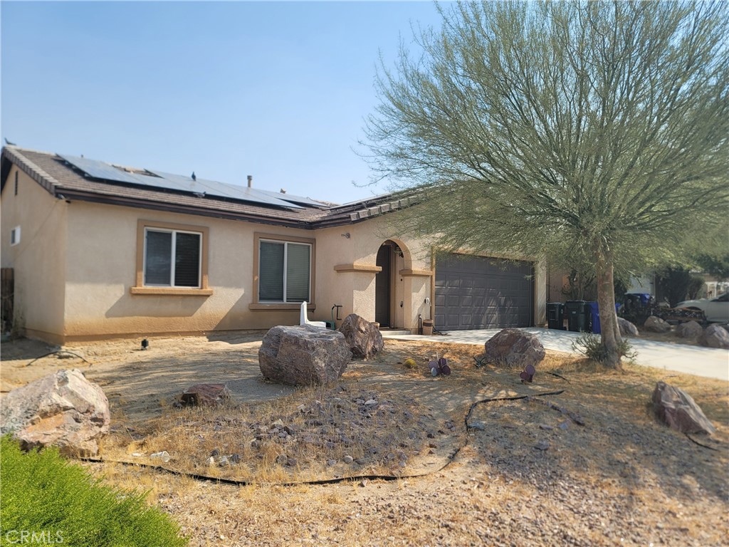 11930 Poppy Road Adelanto, CA 92301 - Photo 3 of 22 a house view with a outdoor space