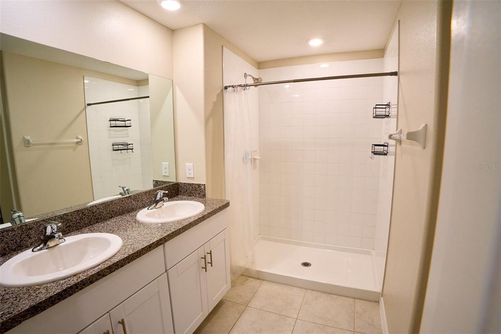 13351 Willow Bluestar Loop Riverview, FL 33579 - Photo 11 of 15 a bathroom with a double vanity sink and a mirror
